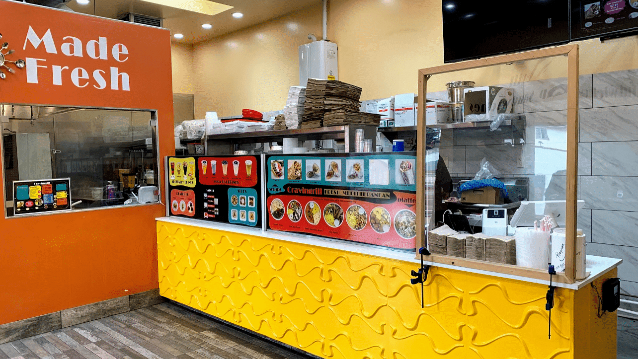 View of the yellow counter in the Cravingrill restaurant